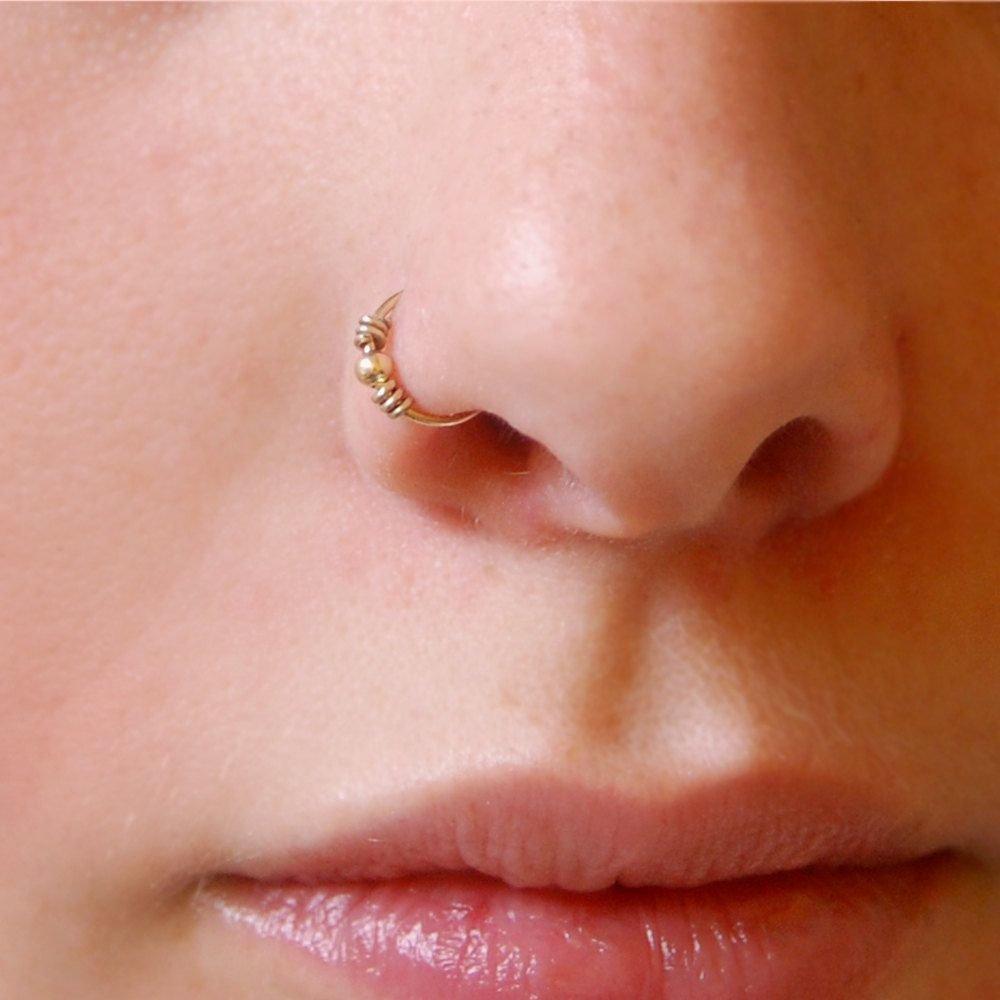 Кольцо в крыло носа